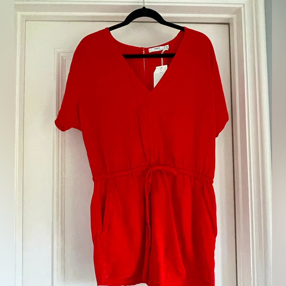 Obey Women’s Red Romper. Size: Medium. Drawstring waistline. Brand New.